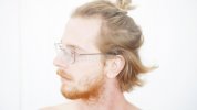 portrait-red-haired-man-beard-manbun-handsome-young-82275873.jpg