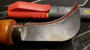 Linoleum knife being sharpened.jpg