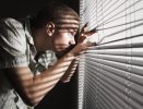 man-looking-through-the-blinds-royalty-free-image-1667828660.jpg