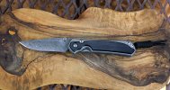 CRK Sebenza 31 Small Bog Oak Boomarang Damascus.jpg