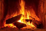 fire-in-a-fireplace-with-logs-and-flames-creating-a-sense-of-warmth-and-coziness.jpg
