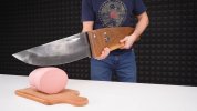 A-giant-knife-cutting-a-giant-hot-dog-or-sausage.jpg