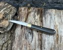 Black-micarta-swayback.jpg Black-micarta-swayback.jpg