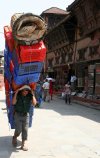 nepalese-man-carrying-heavy-load-street-kathmandu-nepal-30126739.jpg