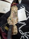 knife in camo sheath.jpg