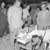WA2936372FBAmericanFilmActorRobertMitchumWatchesaGoatEatsHisBirthdayCakeatHis41stBirthday1958Pos.jpg