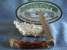 Buck 110 NS Amber Worm Grooved Bone #1.jpg