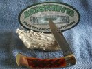 Buck 110 Amber Jigged Bone Partial Chipflint #1.jpg